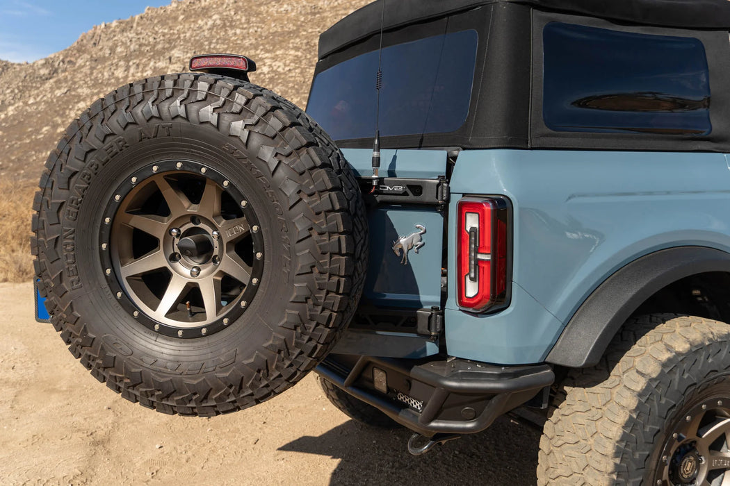 DV8 Offroad Tire Carrier | Fits 2021–2025 Ford Bronco | Heavy-Duty Tailgate Reinforcement | Includes 3rd Brake Light Extension